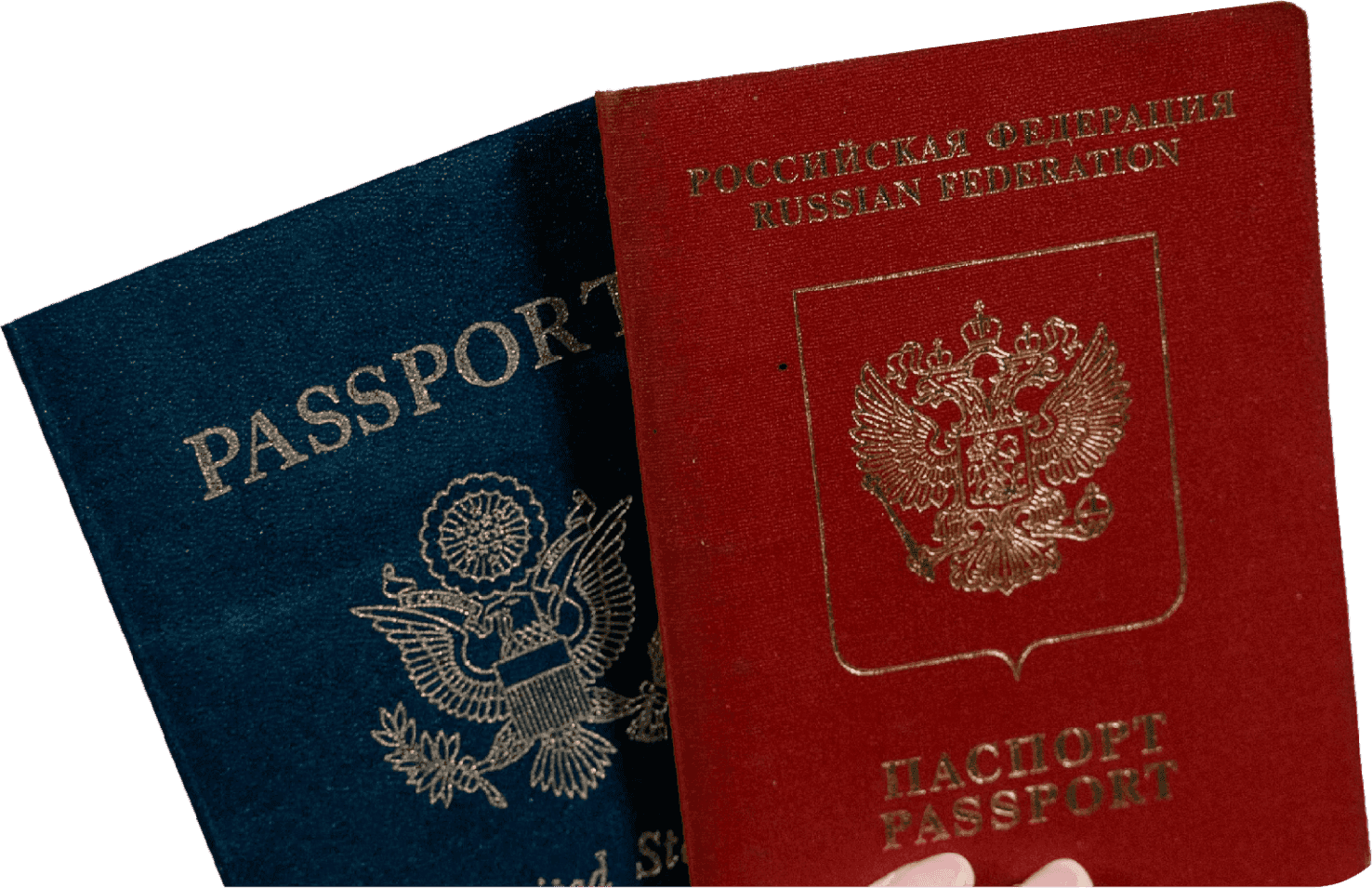 Dual passports symbolizing Barnab’s support for Schengen visa and travel documents.