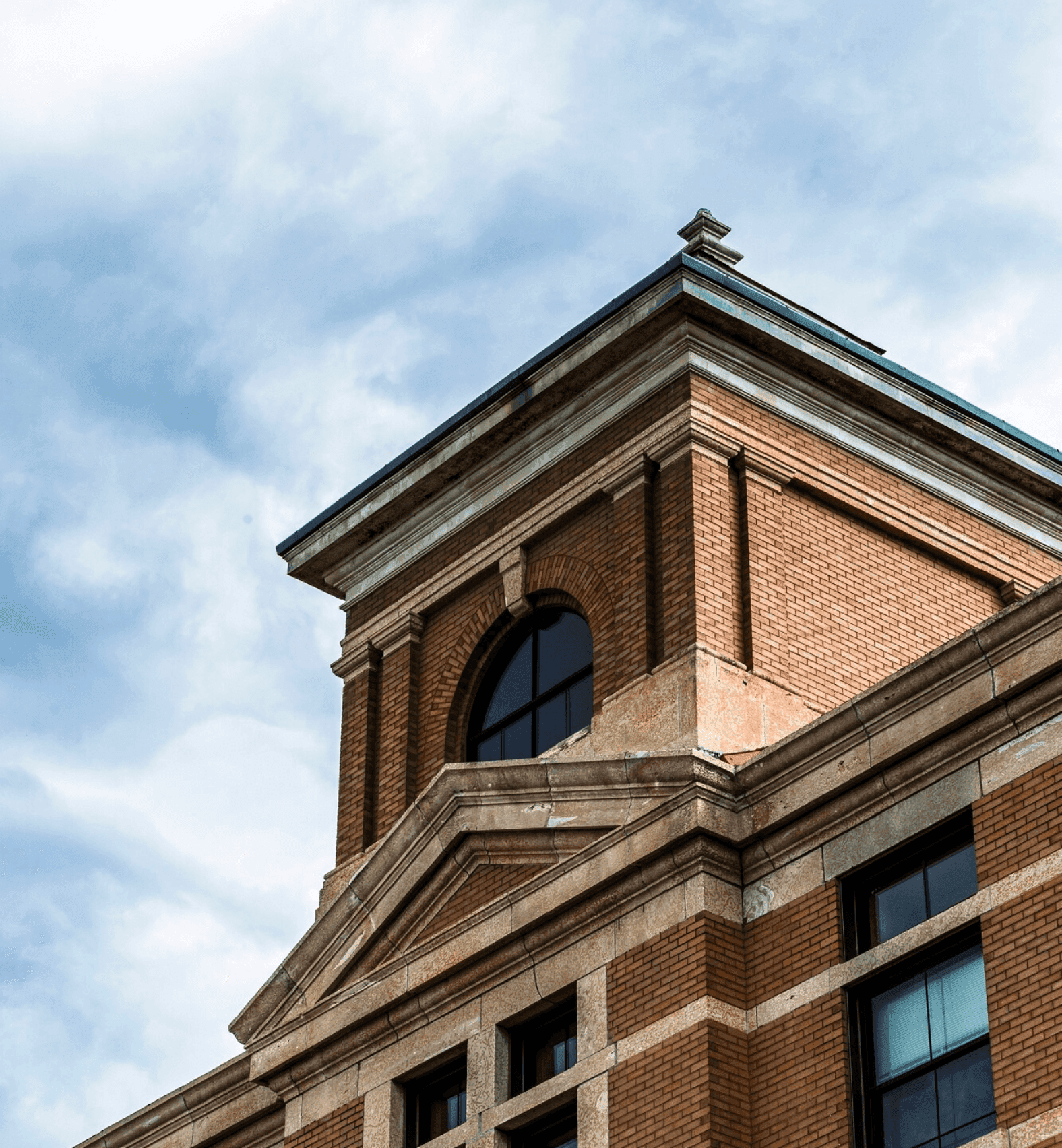 Close-up of a historic brick building featured in premises licence applications.